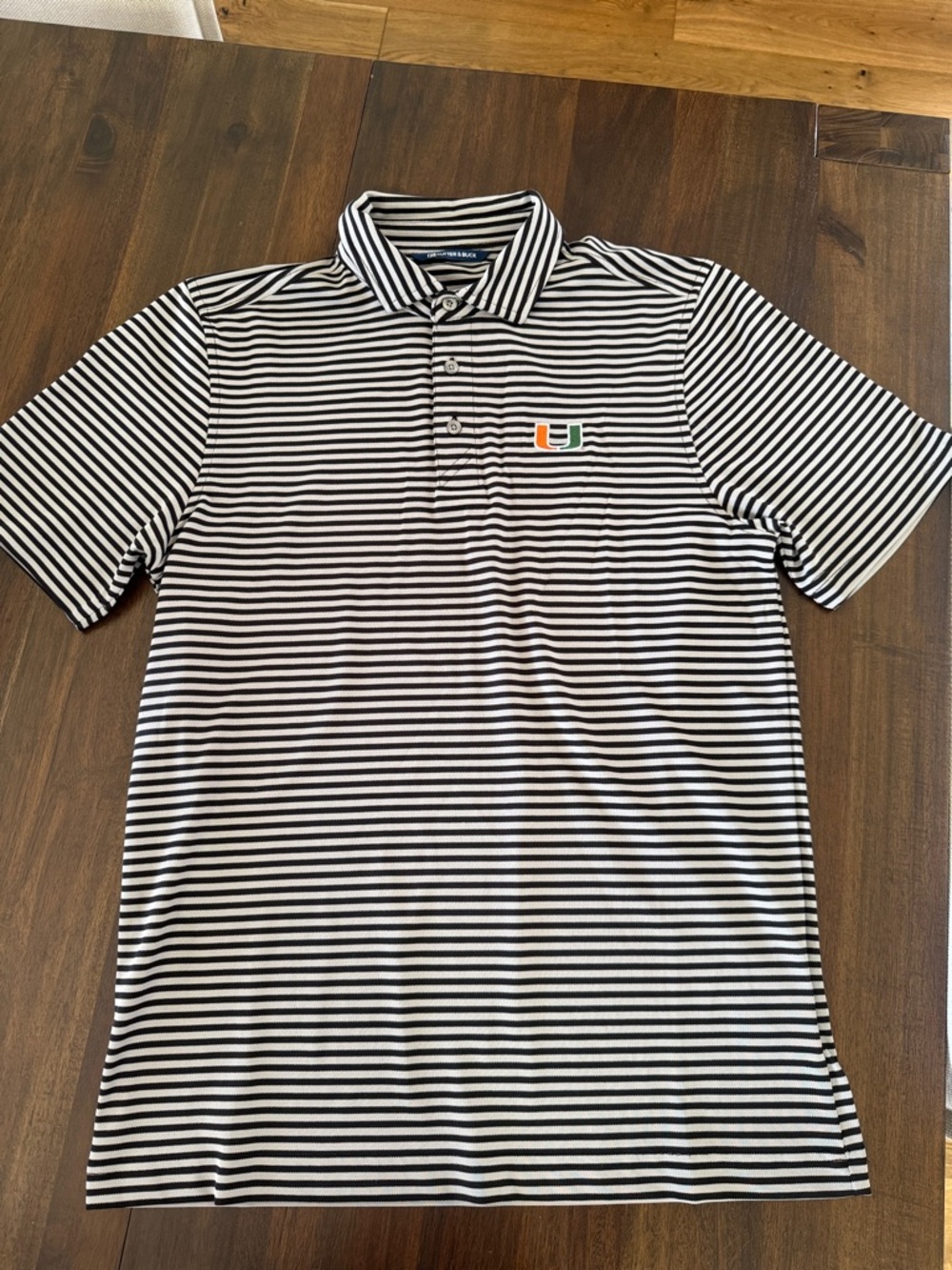 University of Miami Striped Polo Shirt. Cutter & Buck - Black/Gray stripe